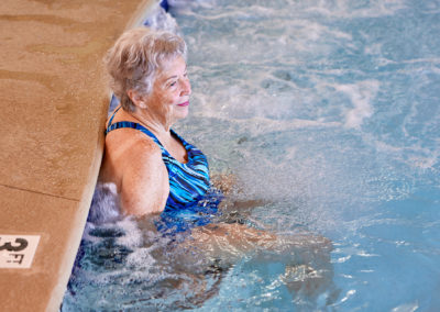 woman relaxing in the indoor pool at taylor glen