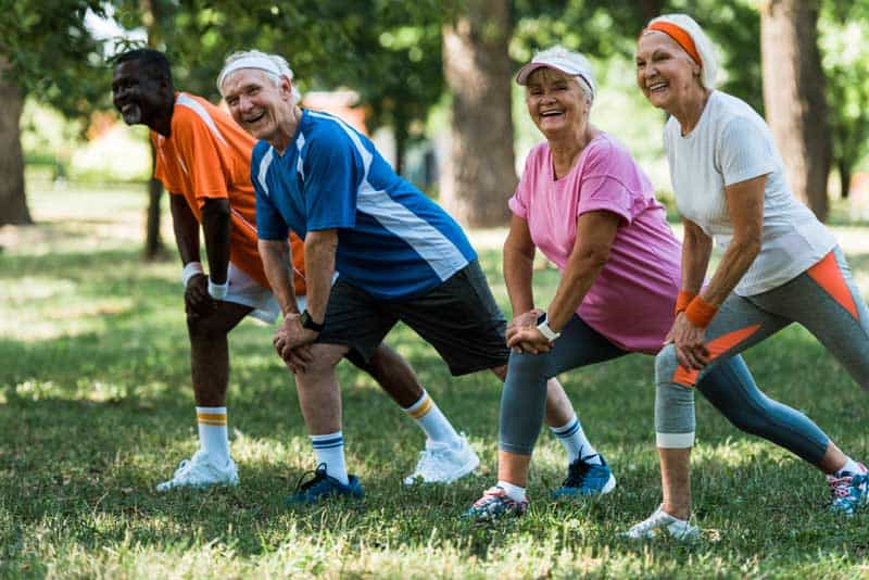 group of seniors stretching outdoors