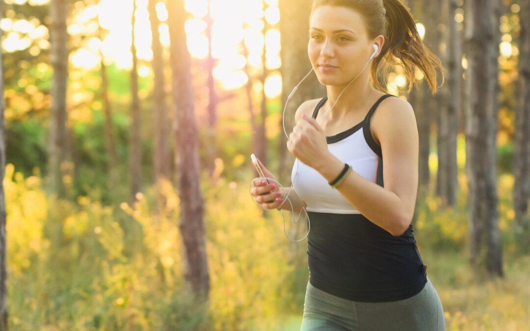 woman jogging with headphones in her ears